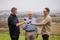 Griff Cupitt and sons toasting Father's Day Three men cheers with red wine on the farm at Cupitts