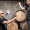 Wally winemaker in winery having wine paoured into glass 
