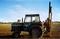 Norman driving the old Leyland, Frank driving posts in.